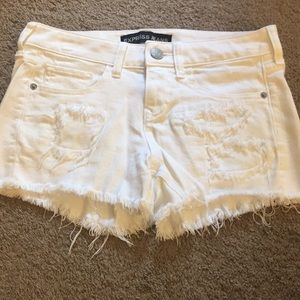Express distressed white denim shorts